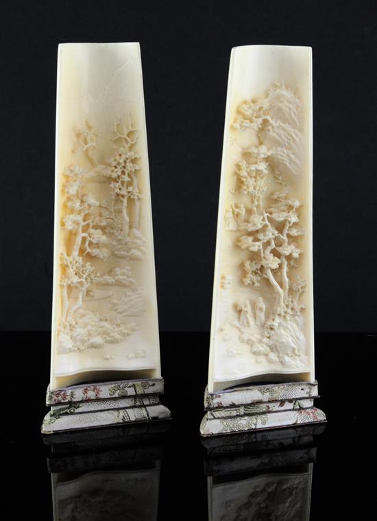 A pair of Chinese ivory wrist rests, early 20th century, 20.5cm, silk brocade covered stands